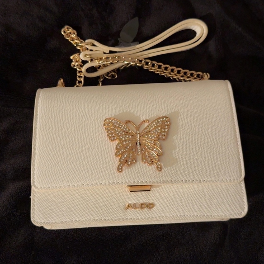 Aldo White Crossbody Bag with Gold Butterfly Accent